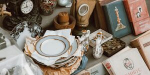 Vintage books and antique ornaments on table